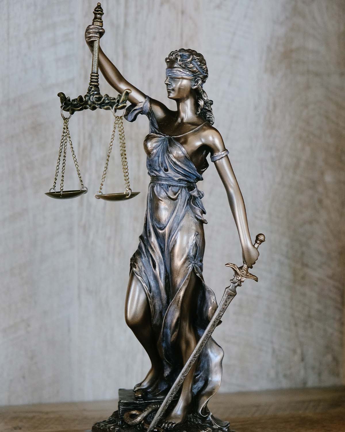 Law concept. Scales of justice with law books on table in a cour