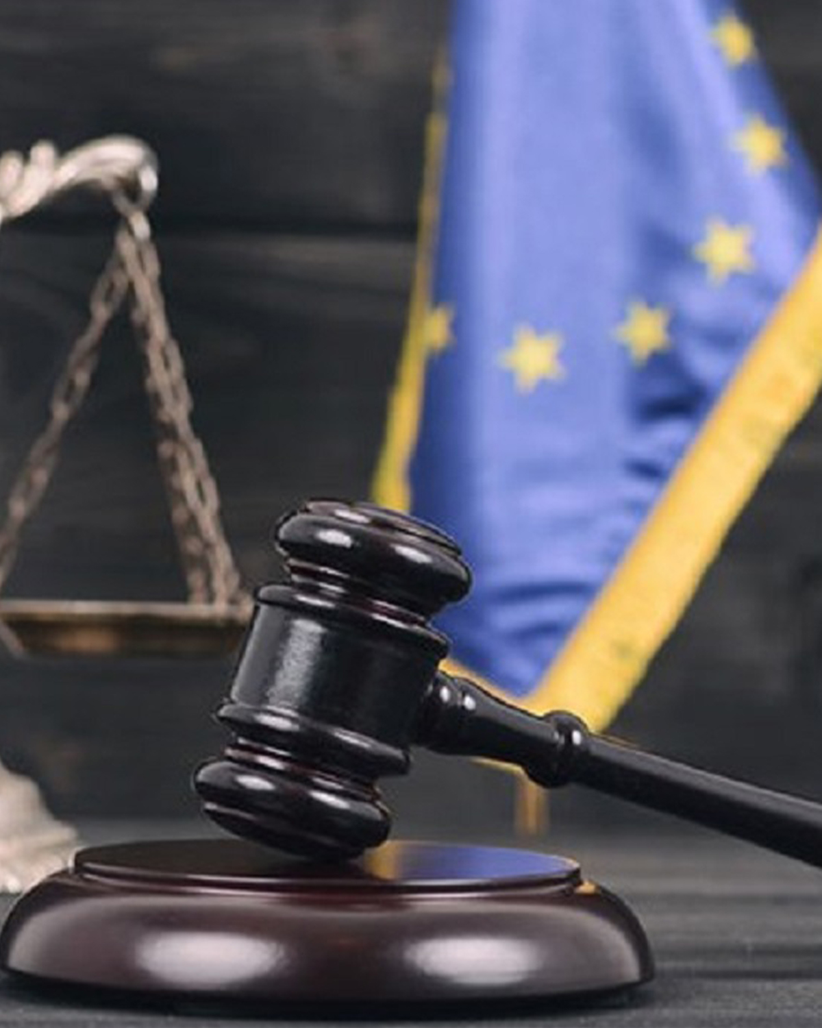 Law concept. Scales of justice with law books on table in a cour