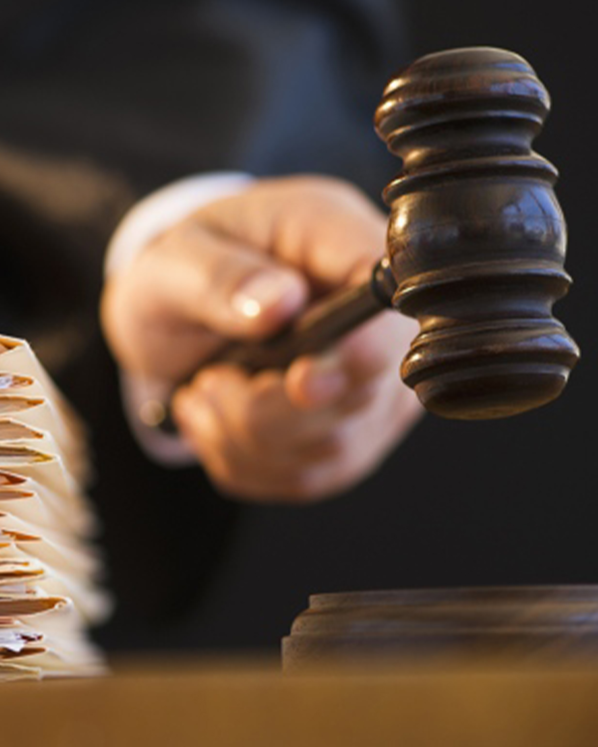 Law concept. Scales of justice with law books on table in a cour